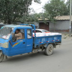 A three-wheeled delivery vehicle, Hegezhuang Hutong.